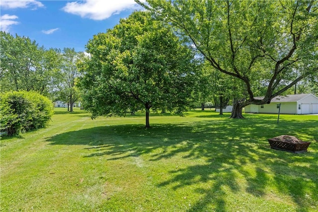 970 Elmgrove Rd, Gates, NY 14624 - view of grassy yard with a fire pit