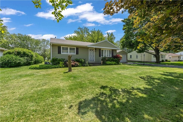 970 Elmgrove Rd, Gates, NY 14624 - view of front facade with a front lawn and a garage
