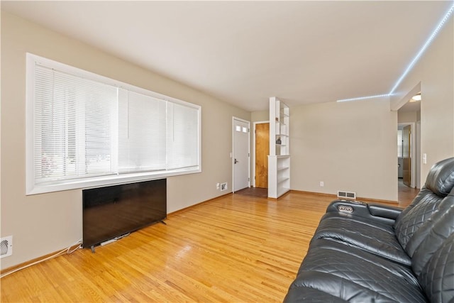 970 Elmgrove Rd, Gates, NY 14624 - living area with wood finished floors and baseboards