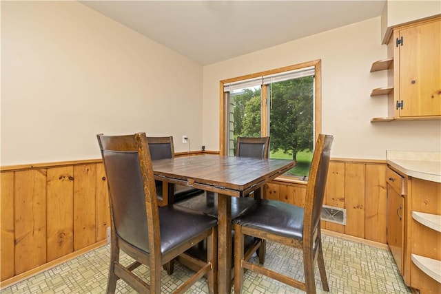 970 Elmgrove Rd, Gates, NY 14624 - dining area featuring wainscoting and wooden walls