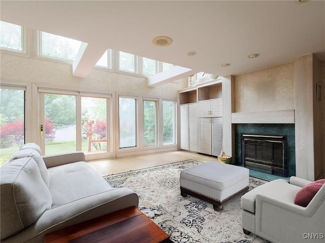 21751 Hewitt Dr, Champion, NY 13619 - living room with a premium fireplace and a skylight