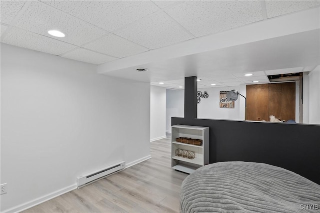 120 Gordon Rd, Clay, NY 13212 - bedroom with a baseboard radiator, a paneled ceiling, wood finished floors, and recessed lighting