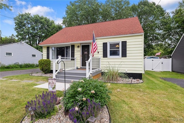 120 Gordon Rd, Clay, NY 13212 - bungalow-style home featuring a gate and roof with shingles