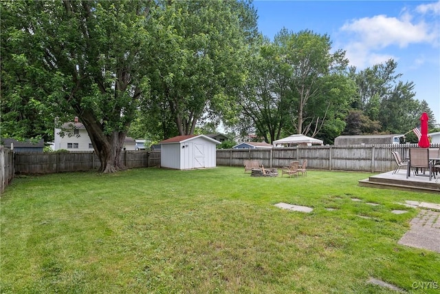 120 Gordon Rd, Clay, NY 13212 - fenced backyard with a storage unit, a fire pit, and a deck