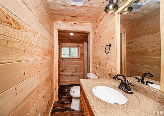 5345 Paddleford Rd, Eaton, NY 13334 - bathroom featuring wooden walls, vanity, wooden ceiling, and wood finished floors
