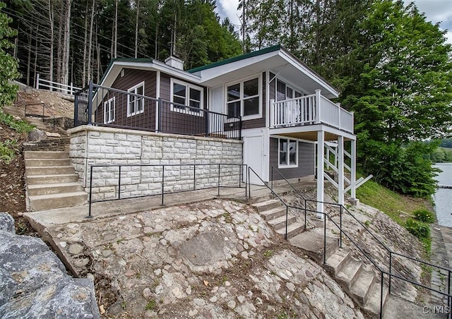 5345 Paddleford Rd, Eaton, NY 13334 - view of front of home with stairs, a patio, and a deck
