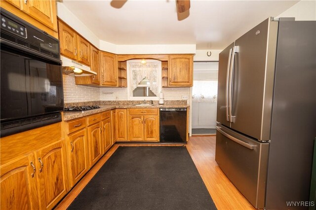 241 Shanley St, Cheektowaga, NY 14206 - kitchen with black appliances, open shelves, light wood-style floors, and tasteful backsplash