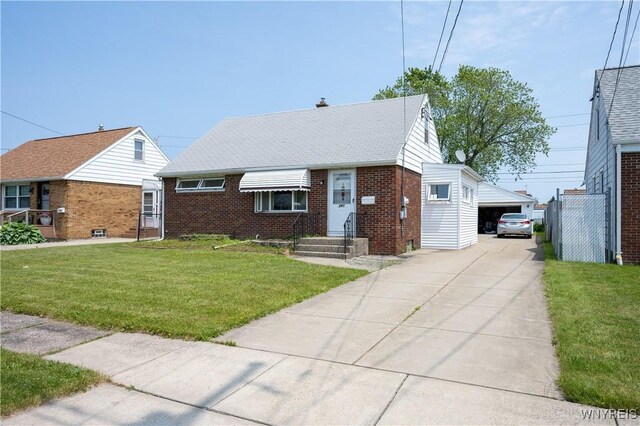 241 Shanley St, Cheektowaga, NY 14206 - bungalow-style house with brick siding, a front yard, a detached garage, and a shingled roof