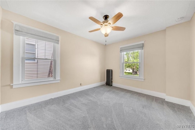749 Colvin Blvd, Tonawanda-Town, NY 14217 - carpeted spare room with radiator, a ceiling fan, and a smoke detector
