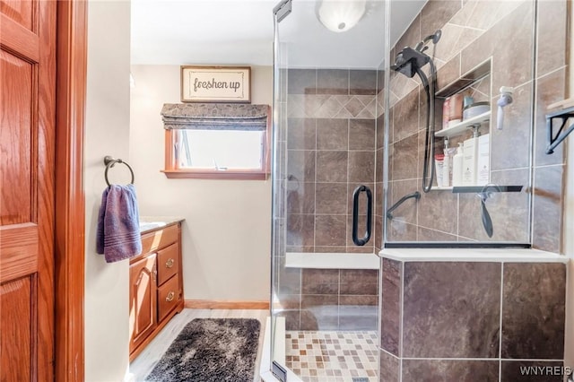 749 Colvin Blvd, Tonawanda-Town, NY 14217 - bathroom with vanity, a stall shower, and wood finished floors