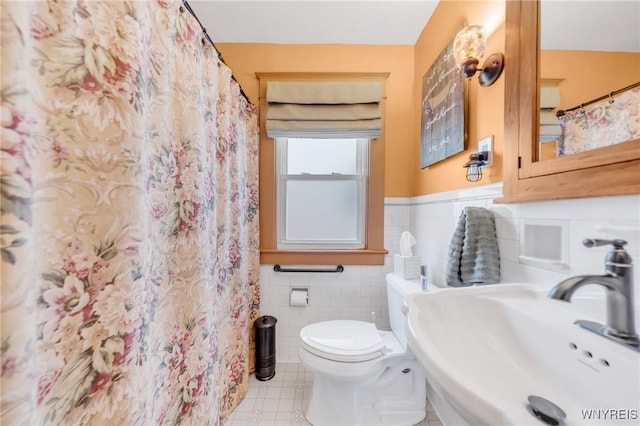 749 Colvin Blvd, Tonawanda-Town, NY 14217 - full bath with tile patterned floors, tile walls, a wainscoted wall, and a shower with curtain
