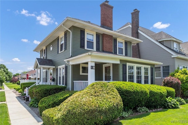 749 Colvin Blvd, Tonawanda-Town, NY 14217 - view of side of property featuring a chimney and a porch