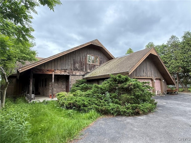 2600 Abend Pt, Marcellus, NY 13110 - view of side of home with driveway and brick siding