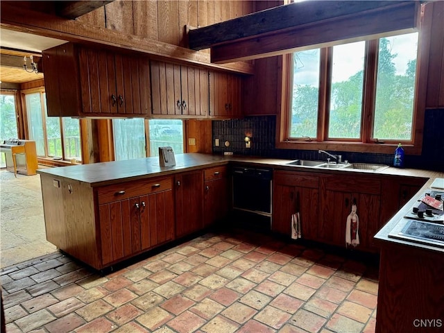 2600 Abend Pt, Marcellus, NY 13110 - kitchen with a peninsula, dishwasher, backsplash, and plenty of natural light