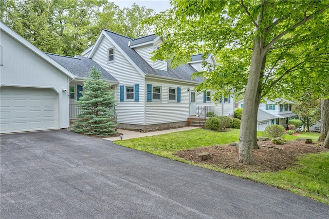 22 Bugbee Rd, Oneonta-City, NY 13820 - view of front facade featuring a garage, driveway, roof with shingles, and a front yard