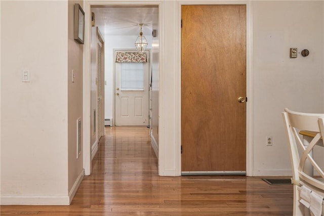 22 Bugbee Rd, Oneonta-City, NY 13820 - hallway featuring wood finished floors and baseboard heating