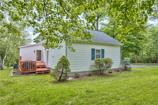 22 Bugbee Rd, Oneonta-City, NY 13820 - view of side of home featuring a lawn, roof with shingles, and a wooden deck