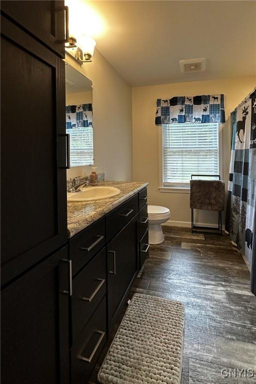 142 S Shore Rd, Webb, NY 13420 - full bathroom with vanity and wood finished floors