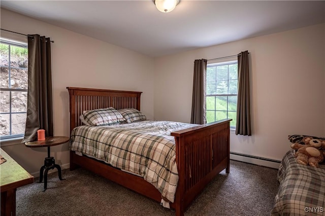 142 S Shore Rd, Webb, NY 13420 - carpeted bedroom featuring a baseboard radiator and multiple windows