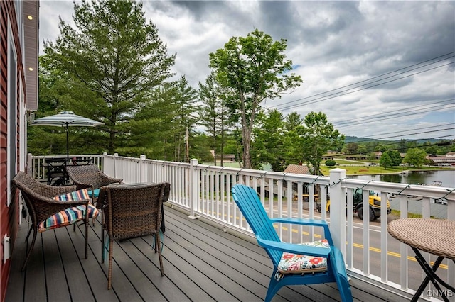 142 S Shore Rd, Webb, NY 13420 - wooden terrace featuring a water view and outdoor dining area