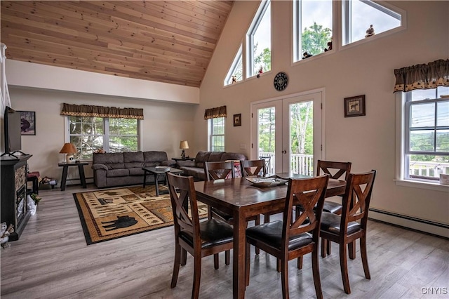 142 S Shore Rd, Webb, NY 13420 - dining area featuring baseboard heating, high vaulted ceiling, french doors, light wood-style floors, and wood ceiling