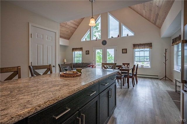142 S Shore Rd, Webb, NY 13420 - kitchen featuring wood ceiling, light wood-type flooring, pendant lighting, high vaulted ceiling, and dark cabinetry