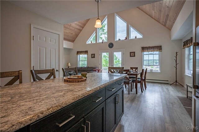 142 S Shore Rd, Webb, NY 13420 - kitchen with wooden ceiling, light wood-type flooring, hanging light fixtures, high vaulted ceiling, and dark cabinets