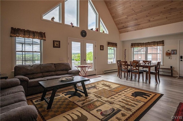 142 S Shore Rd, Webb, NY 13420 - living room featuring high vaulted ceiling, light wood-style floors, a baseboard heating unit, and french doors