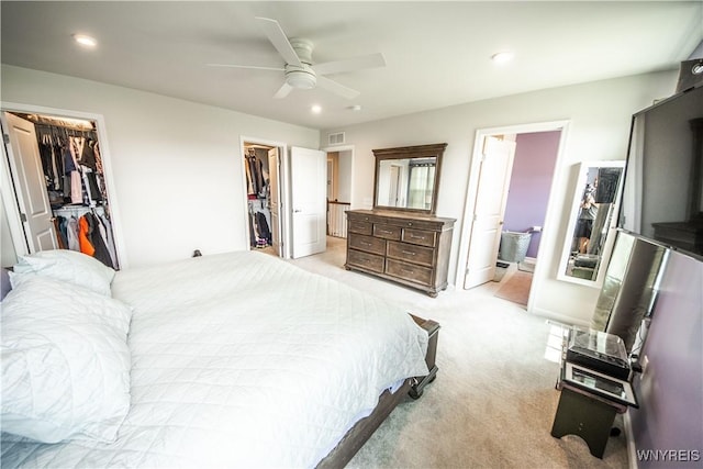 510 Limestone Ct, Grand Island, NY 14072 - bedroom with a spacious closet, light carpet, connected bathroom, ceiling fan, and recessed lighting