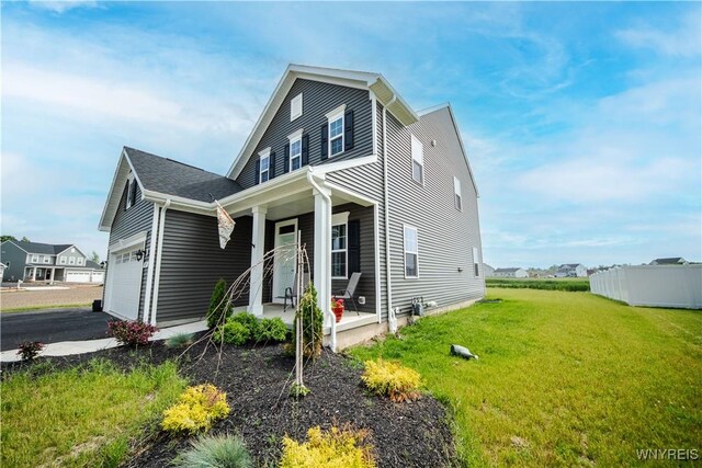 510 Limestone Ct, Grand Island, NY 14072 - view of front of home featuring covered porch, a front lawn, a garage, and driveway
