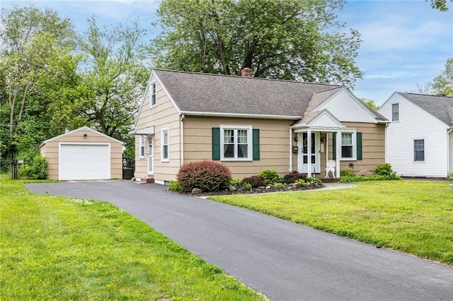 309 Brandon Rd, Irondequoit, NY 14622 - bungalow-style home with an outdoor structure, a garage, asphalt driveway, a front lawn, and roof with shingles