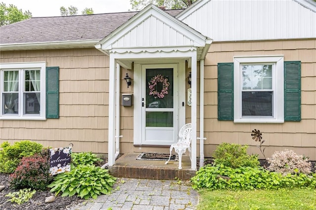 309 Brandon Rd, Irondequoit, NY 14622 - view of exterior entry featuring a shingled roof