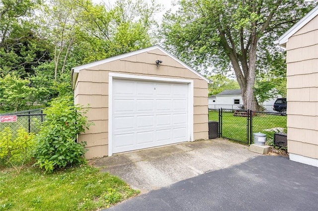 309 Brandon Rd, Irondequoit, NY 14622 - detached garage featuring driveway