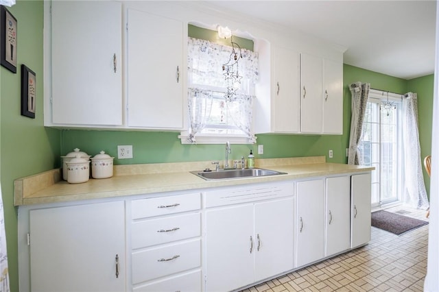309 Brandon Rd, Irondequoit, NY 14622 - kitchen featuring light countertops and white cabinets