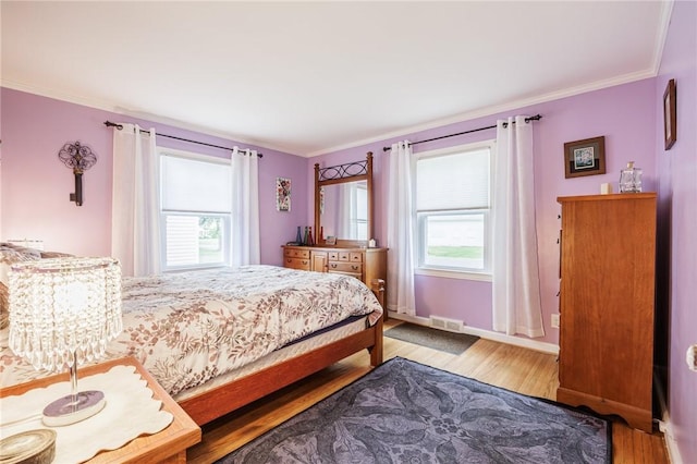 309 Brandon Rd, Irondequoit, NY 14622 - bedroom with light wood-style floors and ornamental molding