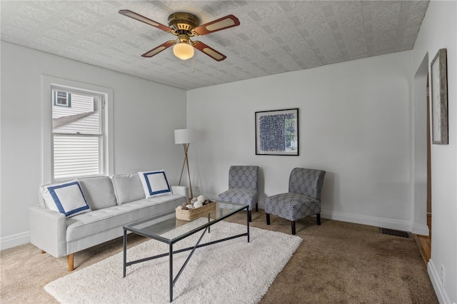 316 Walzer Rd, Irondequoit, NY 14622 - carpeted living area featuring a ceiling fan and baseboards