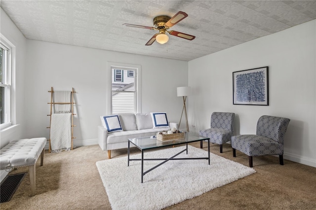 316 Walzer Rd, Irondequoit, NY 14622 - carpeted living room with plenty of natural light, a ceiling fan, and radiator