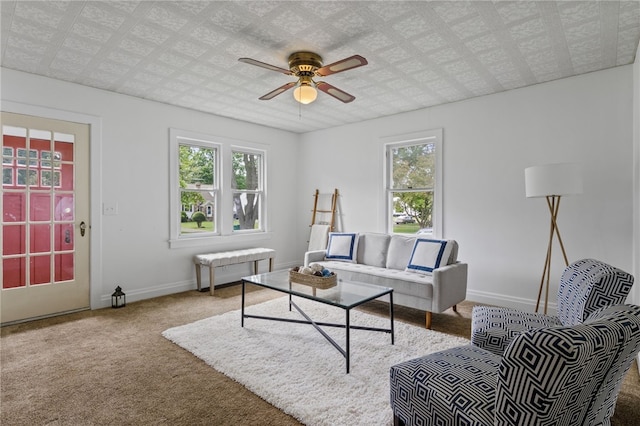 316 Walzer Rd, Irondequoit, NY 14622 - carpeted living area featuring healthy amount of natural light and a ceiling fan