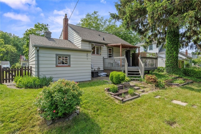 316 Walzer Rd, Irondequoit, NY 14622 - back of house featuring a deck, a chimney, a shingled roof, and a vegetable garden
