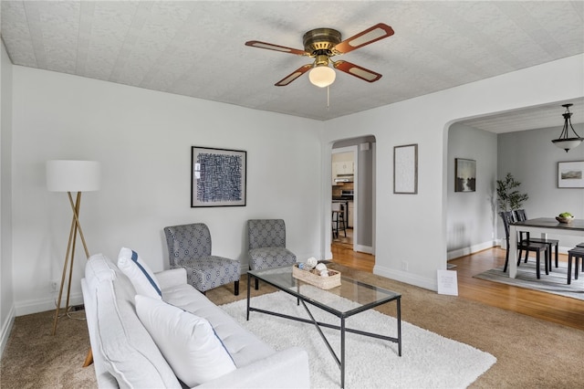 316 Walzer Rd, Irondequoit, NY 14622 - carpeted living room featuring arched walkways and ceiling fan