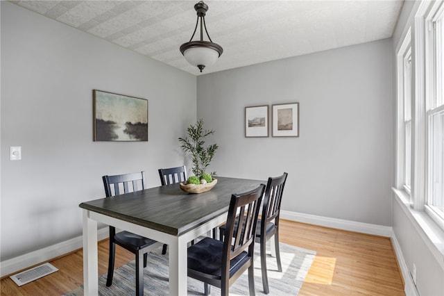 316 Walzer Rd, Irondequoit, NY 14622 - dining room featuring light wood-style flooring and baseboards