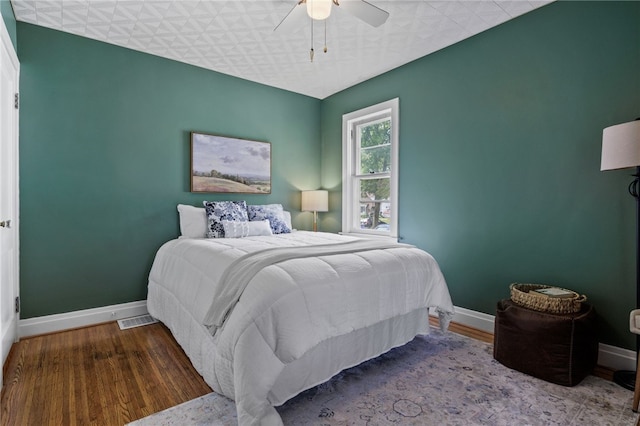 316 Walzer Rd, Irondequoit, NY 14622 - bedroom with wood finished floors and ceiling fan