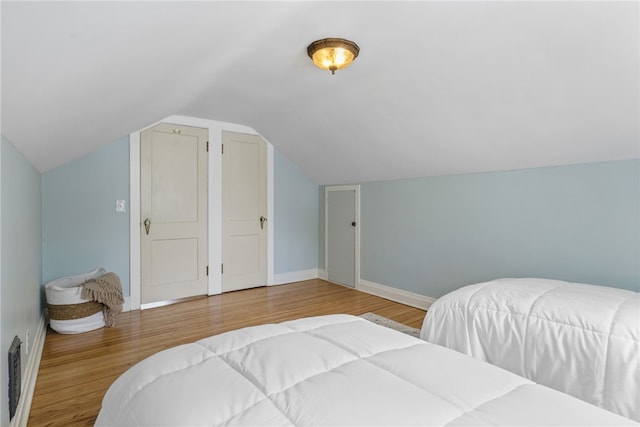 316 Walzer Rd, Irondequoit, NY 14622 - bedroom featuring wood finished floors and lofted ceiling