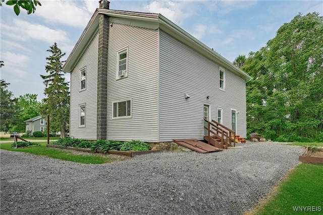 7395 W Somerset Rd, Somerset, NY 14008 - view of home's exterior featuring a chimney and entry steps