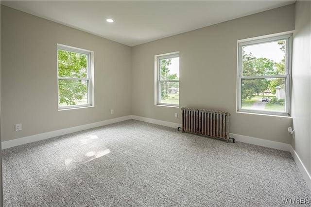 7395 W Somerset Rd, Somerset, NY 14008 - unfurnished room with radiator heating unit, carpet, and recessed lighting