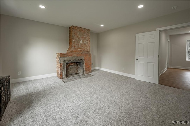 7395 W Somerset Rd, Somerset, NY 14008 - unfurnished living room with carpet, recessed lighting, and a brick fireplace