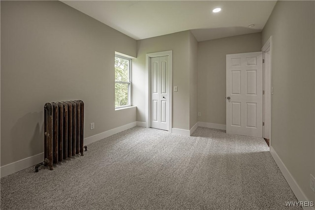 7395 W Somerset Rd, Somerset, NY 14008 - unfurnished bedroom with radiator, carpet flooring, recessed lighting, and a closet