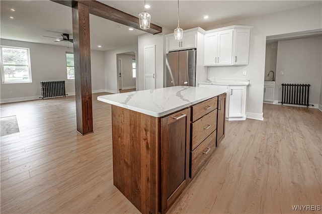 7395 W Somerset Rd, Somerset, NY 14008 - kitchen with radiator, freestanding refrigerator, ceiling fan, open floor plan, and recessed lighting