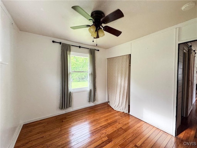 16 Tyler Ct, Manlius, NY 13104 - unfurnished bedroom featuring hardwood / wood-style floors and ceiling fan