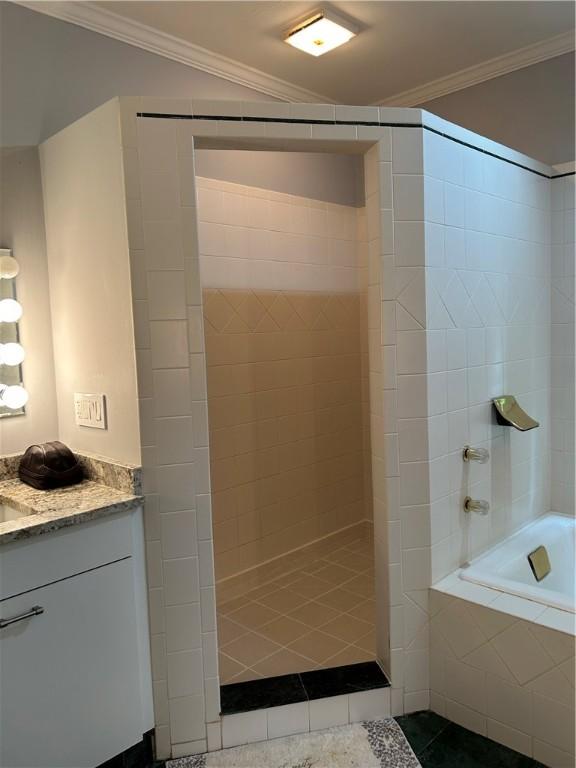 38 Hemlock Ln, Erwin, NY 14870 - bathroom with walk in shower, vanity, ornamental molding, and tiled tub